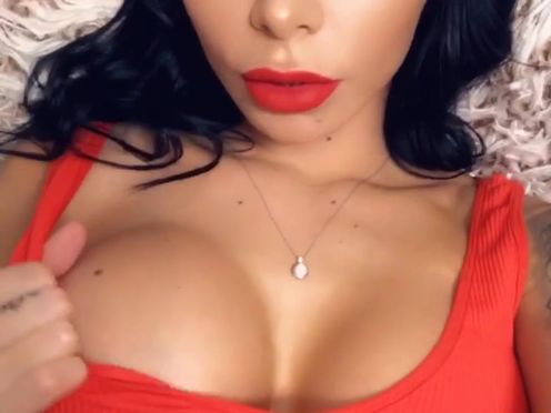 beabeatrice onlyfans busty  cam girl  caresses her lips.